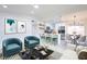 Open-concept living room boasts stylish seating, modern art, and seamless flow to the updated kitchen and dining area at 6170 W University Ave, Las Vegas, NV 89103