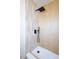Modern walk-in shower with vertical tile design, a rainfall shower head and a built-in bench at 6170 W University Ave, Las Vegas, NV 89103