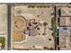 Aerial view showcasing a spacious property with custom landscaping, circular driveway, and a well-maintained home at 7025 N Eula St, Las Vegas, NV 89149