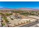 Property featuring an estate showcasing landscaping with decorative features and an impressive architectural design at 7025 N Eula St, Las Vegas, NV 89149