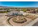 Expansive home with circular drive, decorative landscaping and mountain views from this luxury community at 7025 N Eula St, Las Vegas, NV 89149