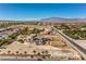 Stunning estate showcasing landscaping with decorative features and an impressive architectural design at 7025 N Eula St, Las Vegas, NV 89149