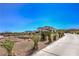 Long driveway and desert landscaping enhance the appeal of this luxurious home at 7025 N Eula St, Las Vegas, NV 89149