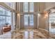 Grand foyer featuring soaring ceilings, elegant columns, and decorative marble flooring at 7025 N Eula St, Las Vegas, NV 89149