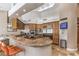 Gourmet kitchen featuring stainless steel appliances, granite countertops, and custom cabinetry at 7025 N Eula St, Las Vegas, NV 89149