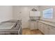 Well-equipped laundry room features granite countertops, cabinets for storage, and a modern washer and dryer at 7025 N Eula St, Las Vegas, NV 89149