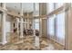 Bright living room boasting high ceilings, decorative columns, and expansive windows at 7025 N Eula St, Las Vegas, NV 89149
