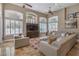 Comfortable open living area with recessed lighting, arched windows, and decorative furniture at 7025 N Eula St, Las Vegas, NV 89149