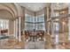 Spacious living room with soaring ceilings, decorative tile flooring, and abundant natural light at 7025 N Eula St, Las Vegas, NV 89149