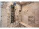 Luxurious shower with rainfall showerhead, body jets, and tiled walls at 7025 N Eula St, Las Vegas, NV 89149