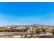 Scenic street view showcasing well-maintained homes, trees, and clear blue skies in a residential neighborhood at 7025 N Eula St, Las Vegas, NV 89149