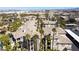 An aerial view of an apartment complex with buildings, balconies, and palm trees at 7163 S Durango Dr # 303, Las Vegas, NV 89113