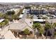 Wide aerial view of an apartment complex with carports, parking, and desert landscaping at 7163 S Durango Dr # 303, Las Vegas, NV 89113