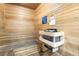 Cozy wooden sauna with multiple levels of seating and a traditional heater at 7163 S Durango Dr # 303, Las Vegas, NV 89113