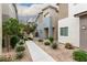 Street view of a modern house with a low maintenance front yard and concrete walkway at 7457 Onyx Star St, North Las Vegas, NV 89084