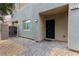 Charming front entrance with pathway, modern door, and well-maintained landscaping at 7457 Onyx Star St, North Las Vegas, NV 89084