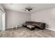 Spacious living room showcasing tile floors, modern ceiling fan, and sliding glass doors for natural light at 7457 Onyx Star St, North Las Vegas, NV 89084