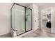 Stylish bathroom featuring a glass-enclosed shower and access to the walk-in closet at 7457 Onyx Star St, North Las Vegas, NV 89084