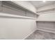 Organized walk-in closet featuring built-in shelving for optimal storage at 7457 Onyx Star St, North Las Vegas, NV 89084
