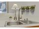 Modern sink features a stylish faucet, accent lighting and decorative plants at 9303 Gilcrease Ave # 2233, Las Vegas, NV 89149