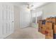 Bedroom with a closet and window with shutters, full of moving boxes and personal items at 9581 Ancala Hollow Ct, Las Vegas, NV 89148