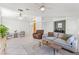 Bright living room with tile floors, high ceilings and comfortable seating at 9581 Ancala Hollow Ct, Las Vegas, NV 89148