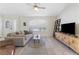 Spacious living room features tile flooring, vaulted ceilings, and large windows at 9581 Ancala Hollow Ct, Las Vegas, NV 89148