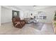 Bright living room with tile floors, high ceilings and comfortable seating at 9581 Ancala Hollow Ct, Las Vegas, NV 89148