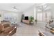 Spacious living room features tile flooring, vaulted ceilings, and large windows at 9581 Ancala Hollow Ct, Las Vegas, NV 89148