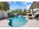 Inviting backyard pool and spa surrounded by lush landscaping, perfect for relaxation and entertainment at 9581 Ancala Hollow Ct, Las Vegas, NV 89148
