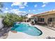 Gorgeous backyard pool and spa with lush landscaping, perfect for entertaining and relaxation at 9581 Ancala Hollow Ct, Las Vegas, NV 89148