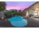 Inviting backyard pool and spa with lush landscaping perfect for outdoor entertaining at 9581 Ancala Hollow Ct, Las Vegas, NV 89148