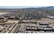 Wide aerial view of a planned community with mountain views in the distance on a sunny day at 10122 Mystic Falls Dr, Las Vegas, NV 89141