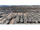 Wide aerial view of many homes in a planned community development on a sunny day at 10122 Mystic Falls Dr, Las Vegas, NV 89141
