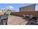 Inviting backyard featuring brick pavers, green turf, outdoor seating and a play structure at 10122 Mystic Falls Dr, Las Vegas, NV 89141