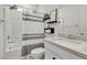 Cozy bathroom featuring a shower-tub combination, tile walls, and modern fixtures at 10122 Mystic Falls Dr, Las Vegas, NV 89141