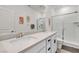 Bathroom featuring a double vanity, large mirror and a glass shower at 10122 Mystic Falls Dr, Las Vegas, NV 89141