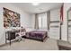 Cozy bedroom with desk, queen bed, neutral carpet, window with shutters, and dresser at 10122 Mystic Falls Dr, Las Vegas, NV 89141