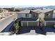 New build boasts a three-car garage, landscaped yard, and neutral color palette at 10122 Mystic Falls Dr, Las Vegas, NV 89141