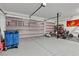 Spacious garage with an epoxy floor features plenty of room for storage and recreation at 10122 Mystic Falls Dr, Las Vegas, NV 89141