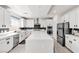 A well-lit kitchen with a large island, stainless steel appliances, and modern finishes at 10122 Mystic Falls Dr, Las Vegas, NV 89141