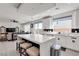 Bright kitchen with a large island, modern appliances, and an open layout to the living space at 10122 Mystic Falls Dr, Las Vegas, NV 89141