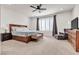 Spacious main bedroom featuring a comfortable bed, stylish furniture, and ample natural light at 10122 Mystic Falls Dr, Las Vegas, NV 89141