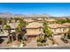 Beautiful aerial view of a well-maintained home with mature trees and desert landscaping in a quiet neighborhood at 1013 Baronet Dr, Las Vegas, NV 89138