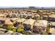 Expansive aerial view of a vibrant residential community with well-maintained homes and desert landscaping at 1013 Baronet Dr, Las Vegas, NV 89138