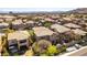 Aerial view of a home with a backyard hot tub and mature trees in a residential community at 1013 Baronet Dr, Las Vegas, NV 89138