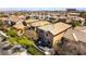 Aerial view of a home with a landscaped backyard and mature trees in a residential community at 1013 Baronet Dr, Las Vegas, NV 89138
