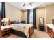 Cozy bedroom with classic wood bed frame, side tables, and dark blue curtains at 1013 Baronet Dr, Las Vegas, NV 89138