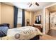 Bedroom featuring classic wood bed frame, side tables, and dark blue curtains at 1013 Baronet Dr, Las Vegas, NV 89138