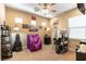Bright bedroom featuring ceiling fan, modern furniture, and interesting wall decor at 1013 Baronet Dr, Las Vegas, NV 89138